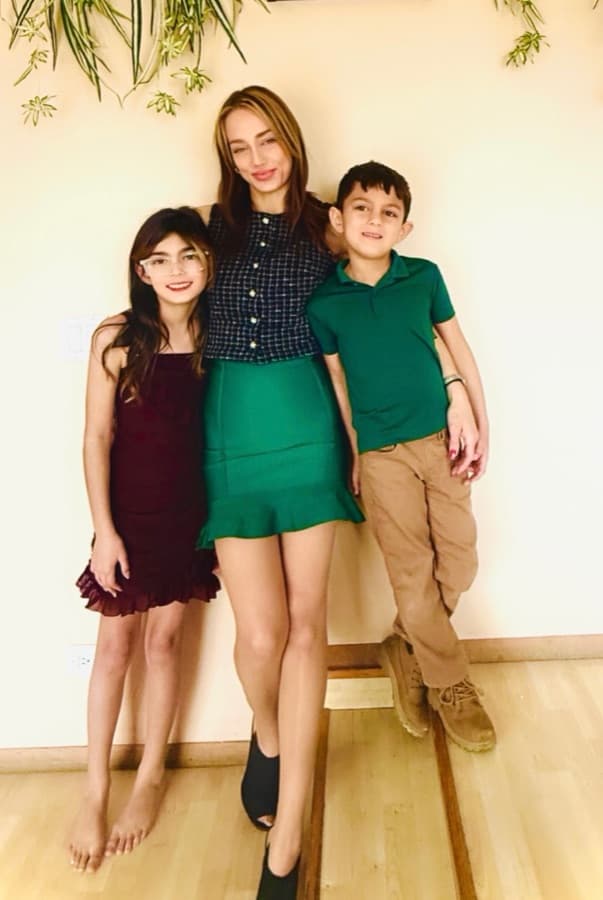 Dorothy Trestka, author of Brushing to the Beat, standing with her two children